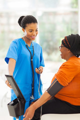 african medical nurse and senior patient