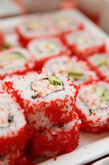 Maki sushi on plate, close-up