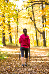 Obraz premium Nordic walking - active girl outdoor
