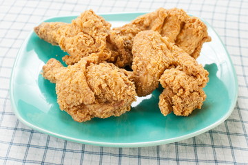 Fried chicken on green dish