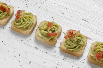 toast, guacamole and tomato