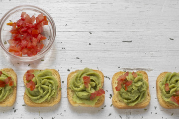 toast, guacamole and tomato