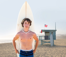 Surfer boy teen with surfboard in Santa Monica