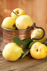 Naklejka na ściany i meble ripe pears in copper jug, still life