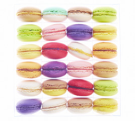 Colourful macaroons in plastic box