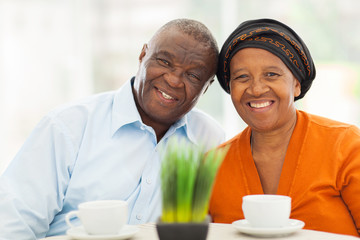 cute senior african couple at home