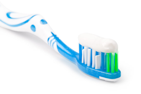 Toothbrush with toothpaste, on a white background