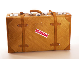 a travel suitcase with a text fragile