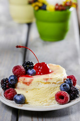 Vanilla cake decorated with fresh fruits. Selective focus