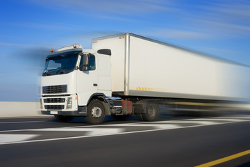 Truck with big white trailer in motion, modified image - 55725226