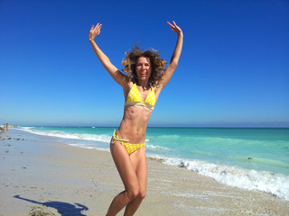 Happy woman on Miami beach.