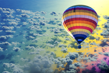 Hot air balloon on sea with cloud