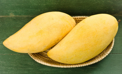 Fresh golden mango in  basket