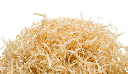 Wood shavings on white background with copy space.