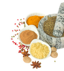 mortar with  spices isolated on white