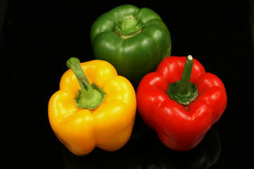 Peppers On A Black Background