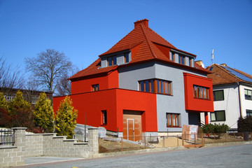 Fototapeta na wymiar Red and grey house