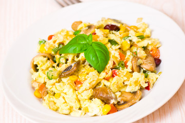 scrambled eggs with mushrooms and vegetables