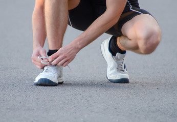 Man tying his sport shoes