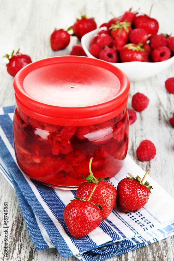 Poster home made berry jam on wooden table