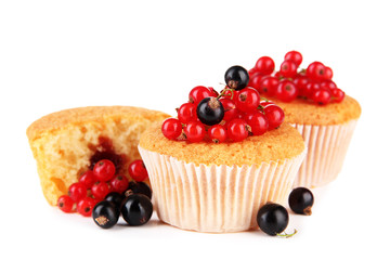 Tasty muffins with berries isolated on white