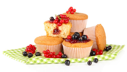 Tasty muffins with berries isolated on white