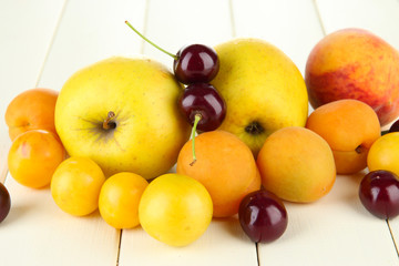 Naklejka na ściany i meble Bright summer fruits on wooden table close-up