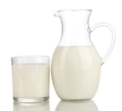 Milk in jug and glass isolated on white
