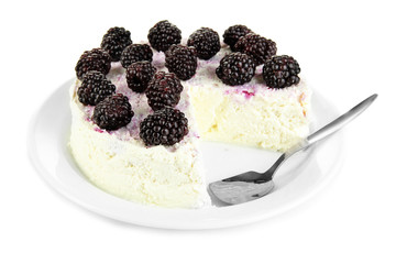 Cheesecake with fresh berries on white plate isolated on white