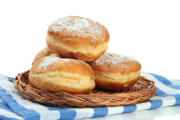 Tasty donuts on wicker plate, isolated on white