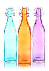 Colorful bottles isolated on white
