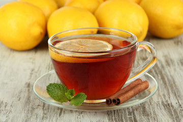 Cup of tea with lemon on table close-up