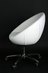 Fototapeta premium White chair on black background