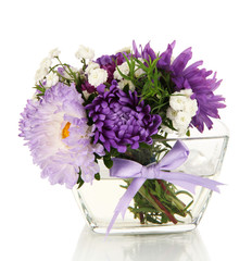 Beautiful bouquet of bright flowers in glass vase, isolated