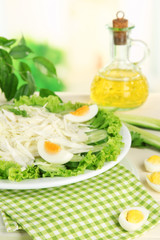 Delicious salad with eggs, cabbage and cucumbers on wooden