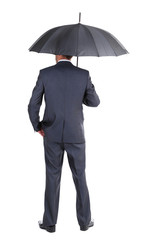 Businessman with umbrella, isolated on white