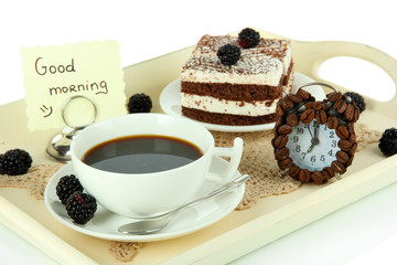 Cup of tea with cakes on wooden tray isolated on white