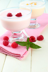 Delicious yogurt with berries on table close-up