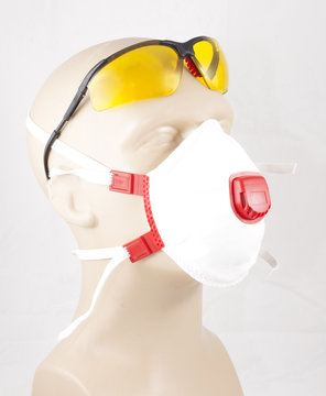 eyewear and white dust mask on mannequin