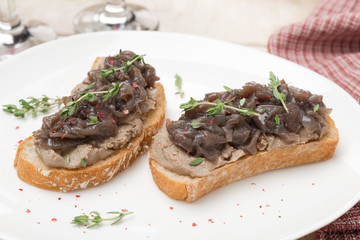 toast with liver pate, caramelized red onion and thyme close-up