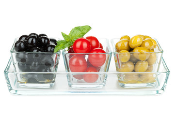 Black and green olives and tomatoes with basil