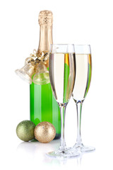 Champagne bottle, glasses and christmas decor