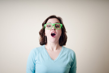 beautiful young woman with green eyeglasses