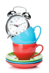 Coffee cups and alarm clock