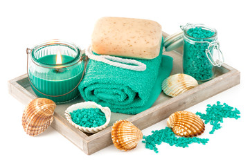 Fototapeta na wymiar Spa and bath accessories with soap, towel and sea salt