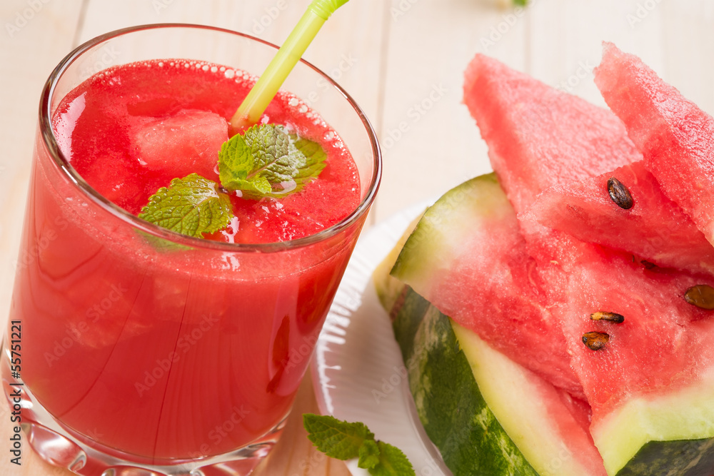 Wall mural fresh watermelon juice with pieces of fruit