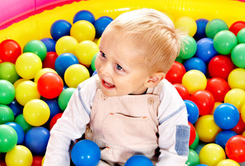 Fototapeta na wymiar Child in colored ball.