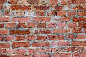 Obraz premium Old weathered grunge red brick wall as background