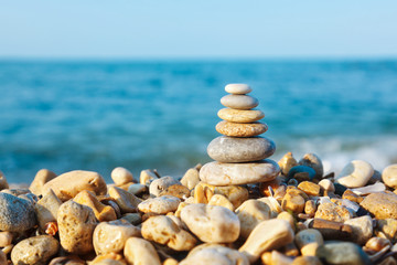 Fototapeta na wymiar Stacked pebbles on the sea side