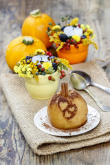 Baked apple decorated with cinnamon heart shape ornament